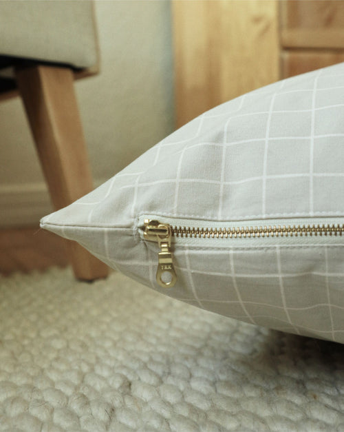 Top-down view of Hampton tan windowpane dog bed showcasing plush interior and design.