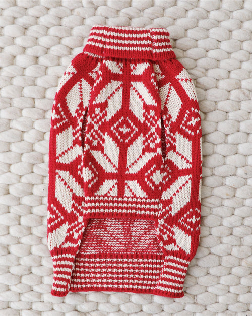 Cozy knit dog sweater with Santa-inspired design for winter warmth.
