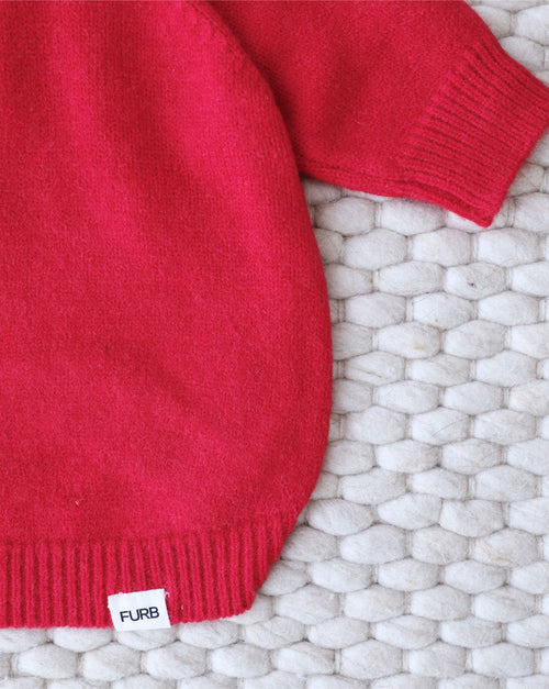 Close-up of sporty red dog hoodie showing comfortable and soft fabric.