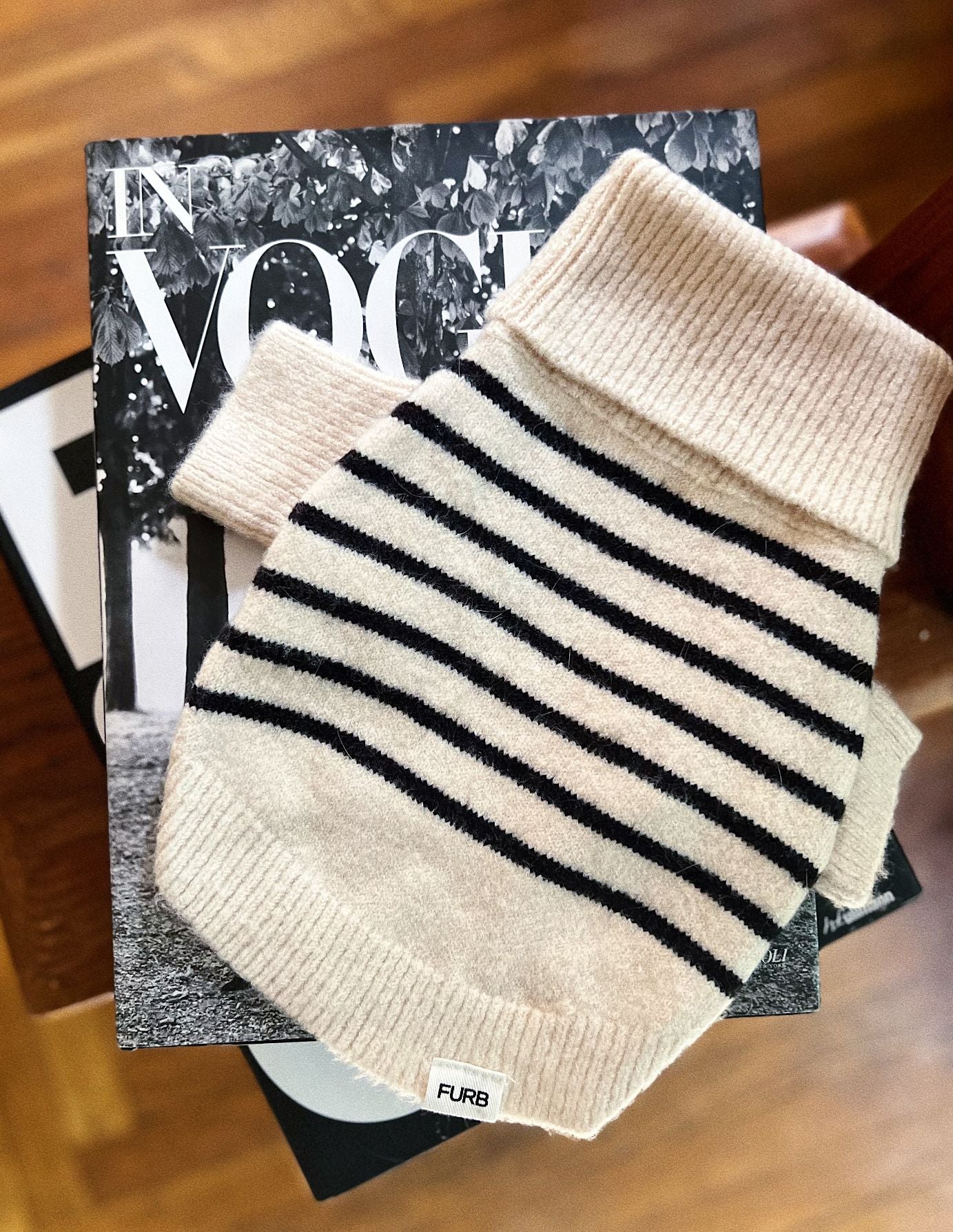 a striped dream, with a comfy ivory knit body covered in thin black stripes, and perfect ribbed ivory turtleneck with coordinating sleeves. The long turtleneck folds over as a toasty touch, and sleeves can be cuffed for a more casual vibe
