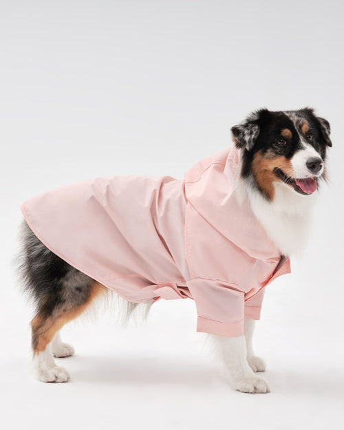 Waterproof pink dog jacket for small breeds, cozy and durable design.