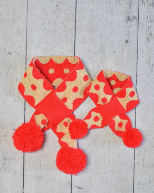 Cozy reversible dog scarf with festive holiday pattern, ideal for small dogs.