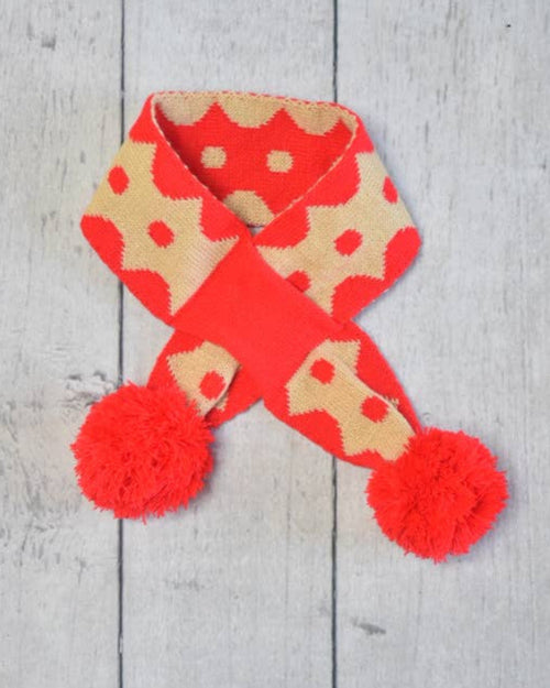 Reversible festive dog scarf with red and green holiday colors, cozy winter accessory.