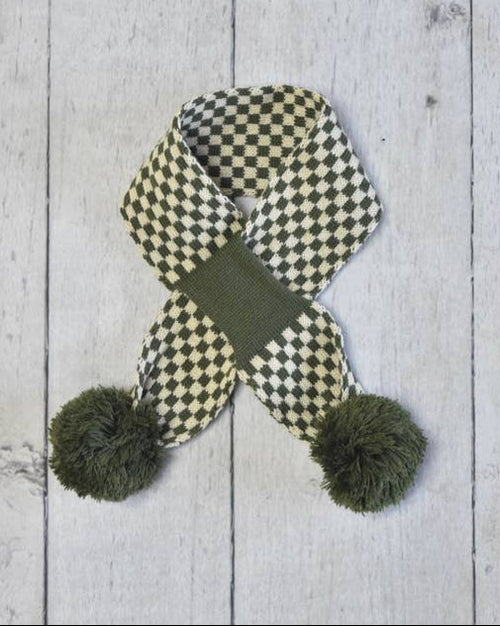 Green dog scarf with knit texture, stylish winter accessory for small dogs.