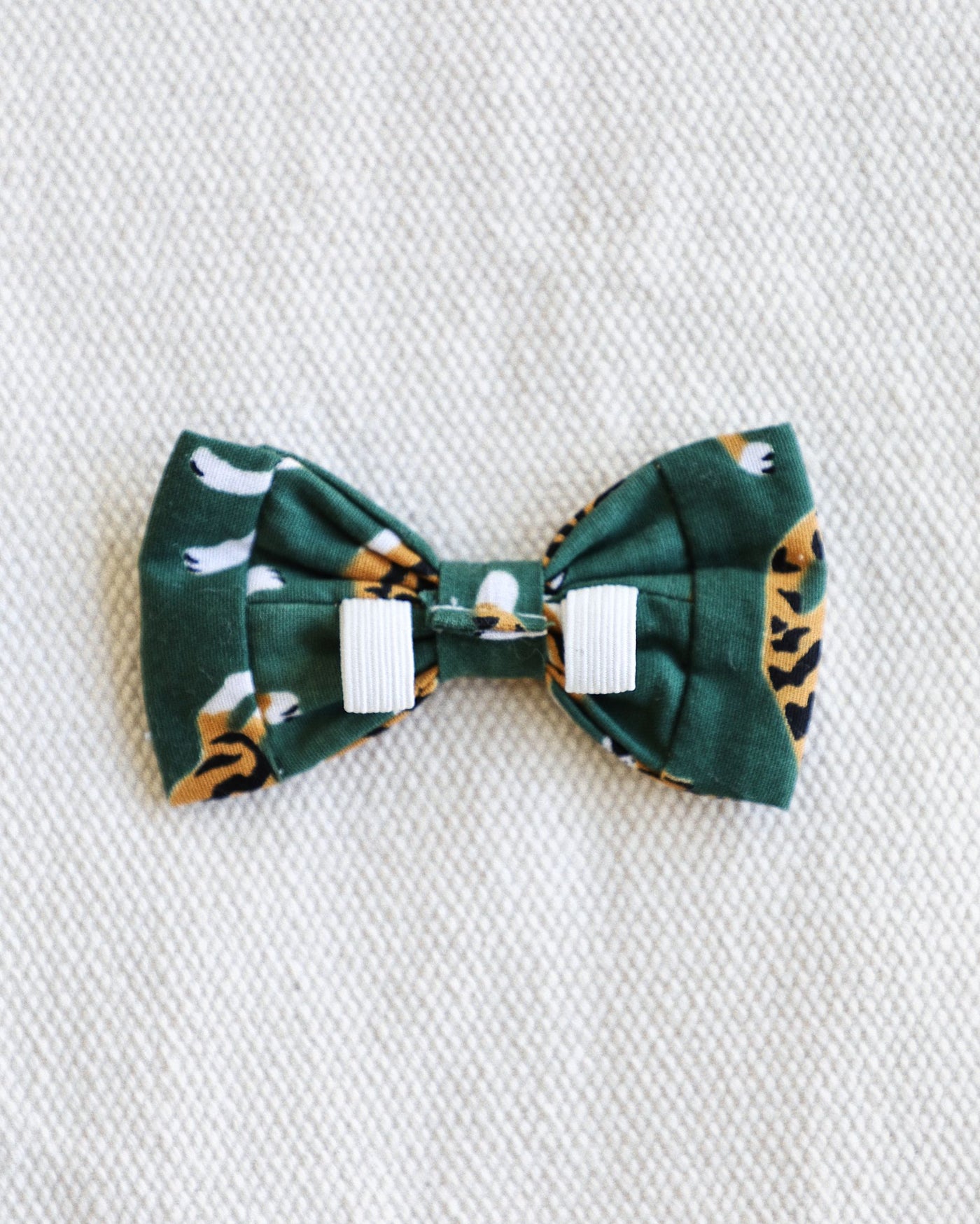 This bow tie is made of durable cotton, complete with loops that slide easily over your pup's collar