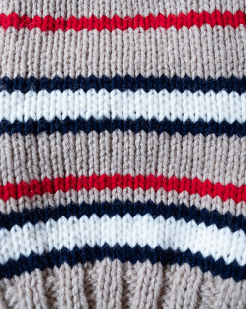 Striped tan alpaca sweater for dogs, designed for warmth and style.