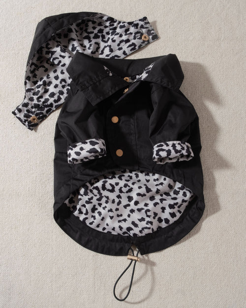 black dog raincoat with leopard print lining and removable hood. corgi rain coat