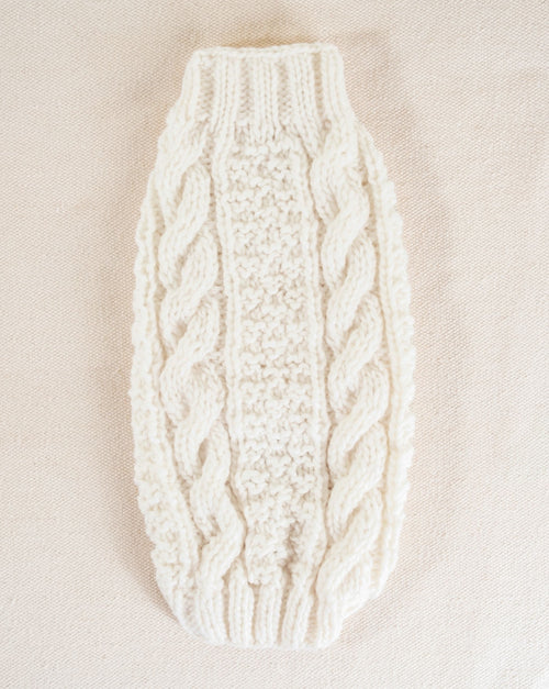 Cable-knit dog sweater, ideal for chilly days, providing comfort and warmth for your dog