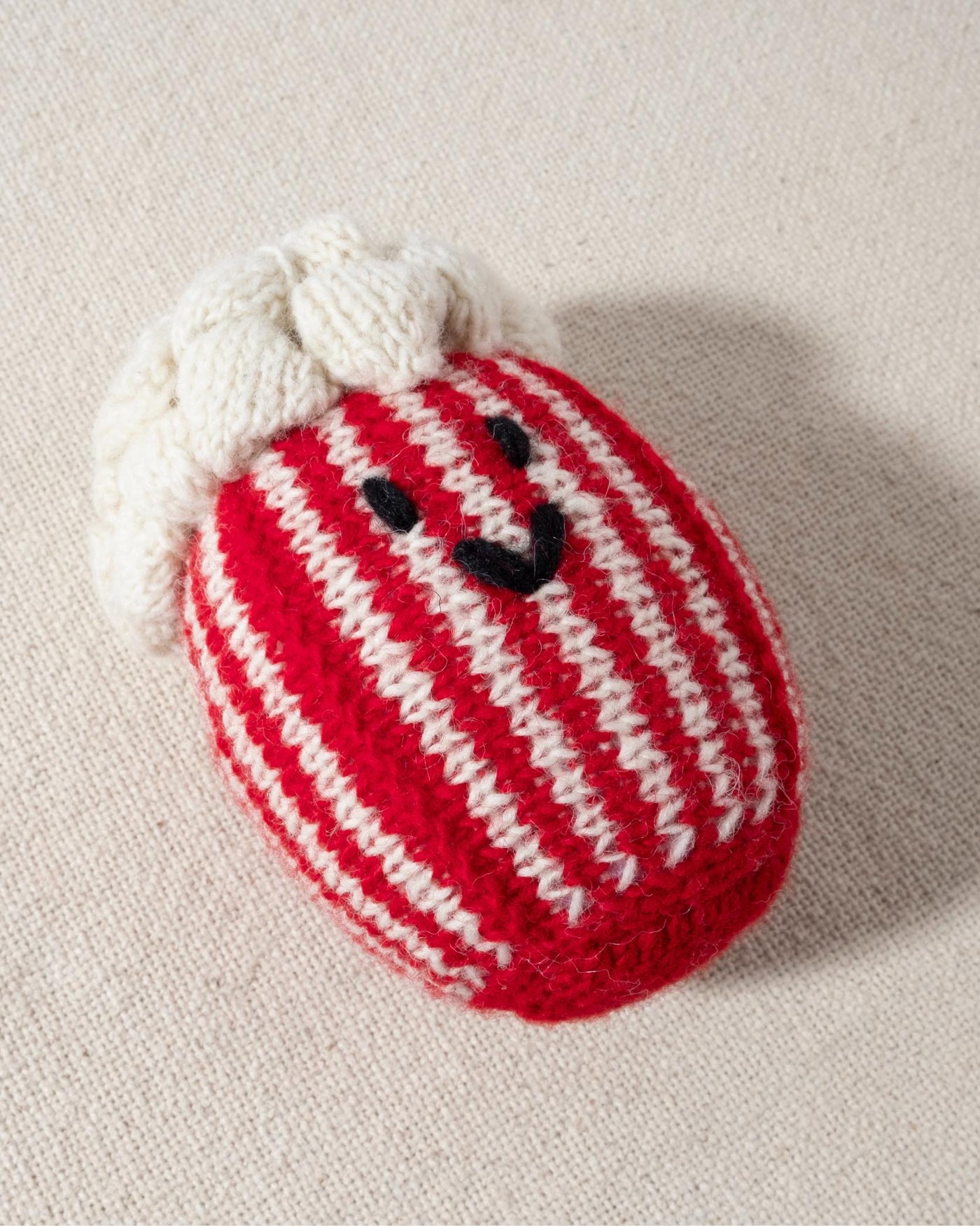 red and white hand knit crochet popcorn dog toy