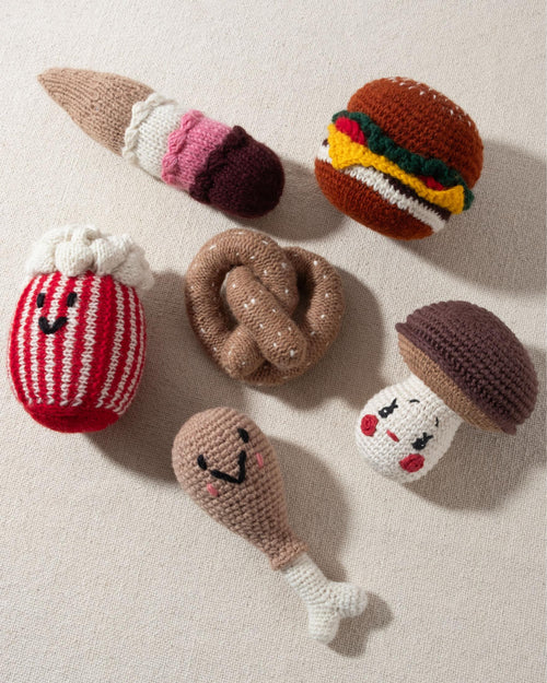 tan and white hand knit crochet pretzel dog toy