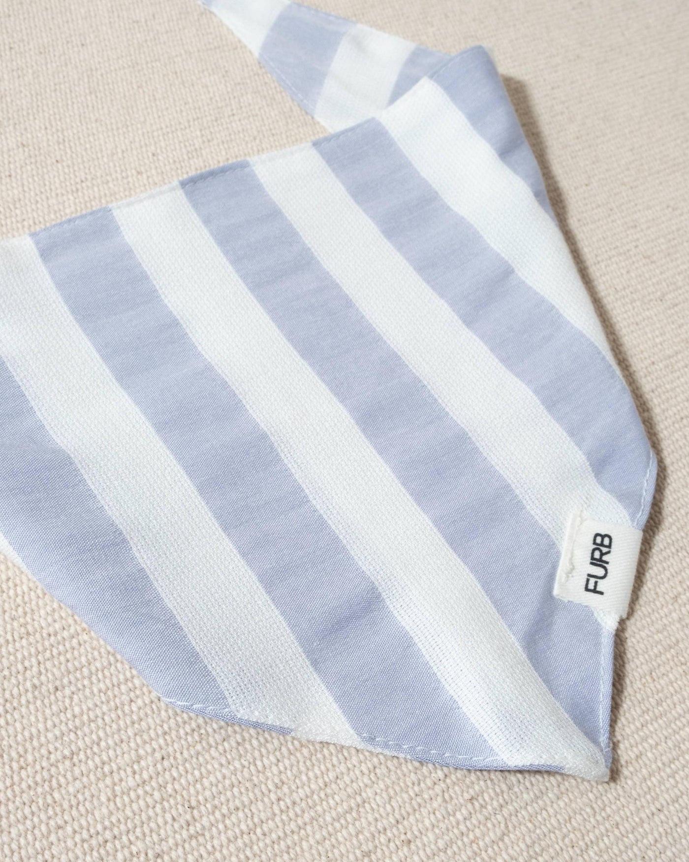 blue and white striped dog bandana with tasteful furb tag