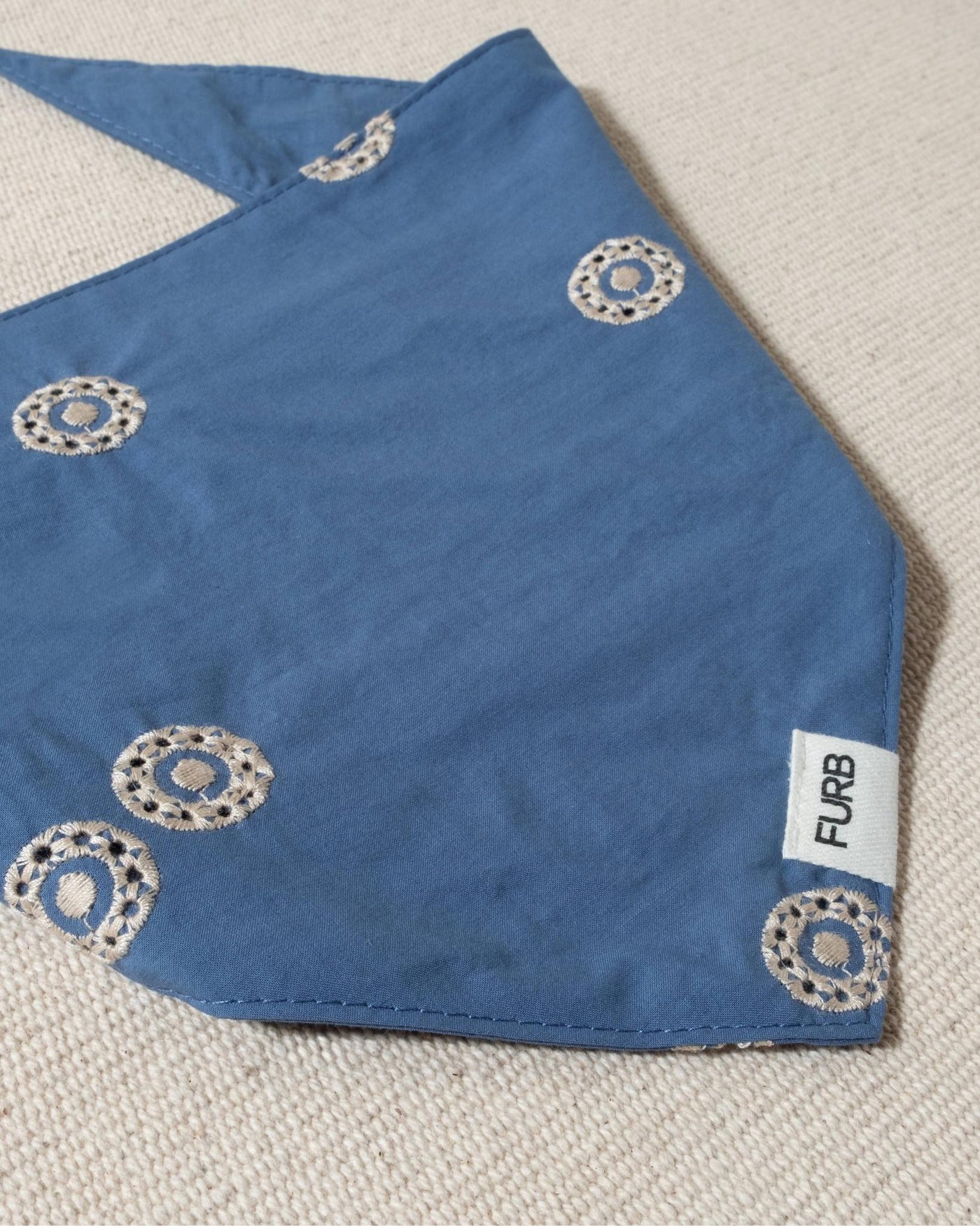 blue dog bandana with white embroidery and tasteful furb logo