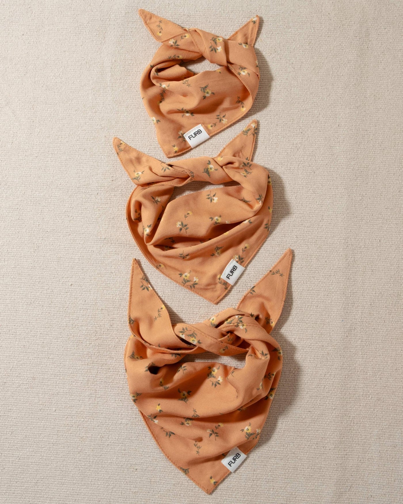 peach floral dog bandana and tasteful furb logo
