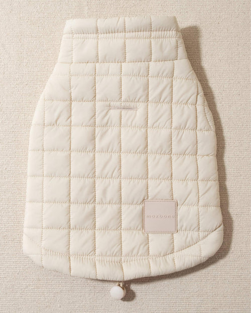 perfect on its own or layered with a cute sweater. This quilted, stylish jacket is fully adjustable, with coordinating sand cords on the hem, neck, and arm openings. Jacket can be worn over harness, with a small opening for leash attachment on the back. Asymmetrical buttons also make for more secure wear, for even the most portly of pups!. beagle puppy jacket