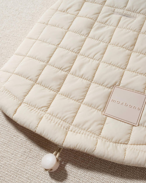 perfect on its own or layered with a cute sweater. This quilted, stylish jacket is fully adjustable, with coordinating sand cords on the hem, neck, and arm openings. Jacket can be worn over harness, with a small opening for leash attachment on the back. Asymmetrical buttons also make for more secure wear, for even the most portly of pups!. corgi lightweight jacket