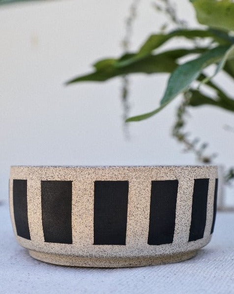 Each bowl is handmade with ceramic stonewear and striped, complete with a glaze to guarantee your pet eats and drinks safely. These bowls may vary in color and patinas, aging gracefully alongside your furry BFF.