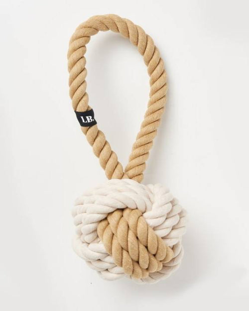 Tan and white rope knot dog toy, perfect for small breeds like Poodles and Beagles.