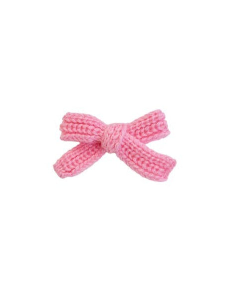 Bright pink dog hair bow, adding a stylish and fun touch to any dog outfit