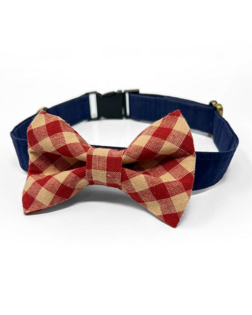 Trendy red and tan dog bow tie for special occasions.