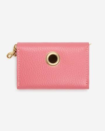 Close-up of pink poop bag holder with clip, perfect for fashionable dog owners and breeds like Maltese and Miniature Schnauzers