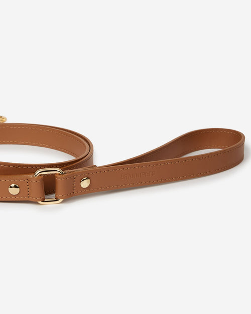 Angled view of camel leather dog leash handle, ergonomic and comfortable for walking small and medium dogs