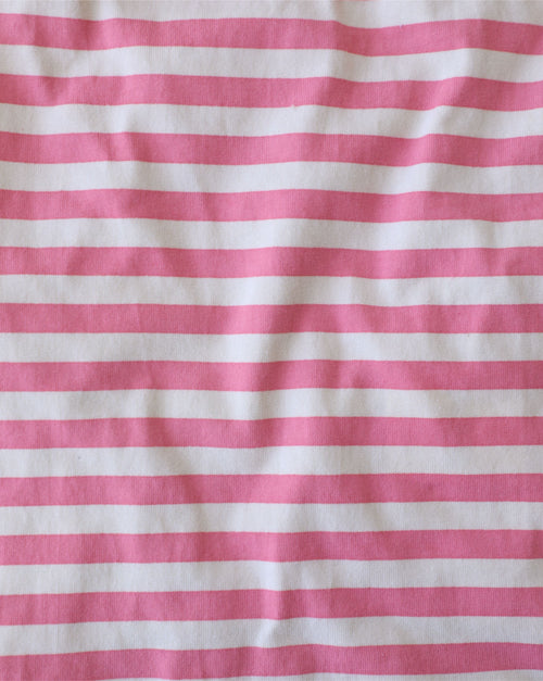 Side view of dog wearing Tickled Pink striped t-shirt, emphasizing lightweight fabric.