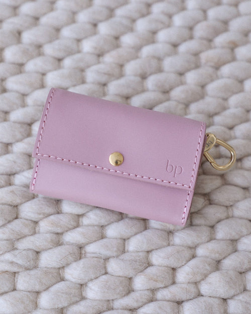 Lifestyle image of small dog wearing mauve studded leather collar with matching leash for safe and stylish walks