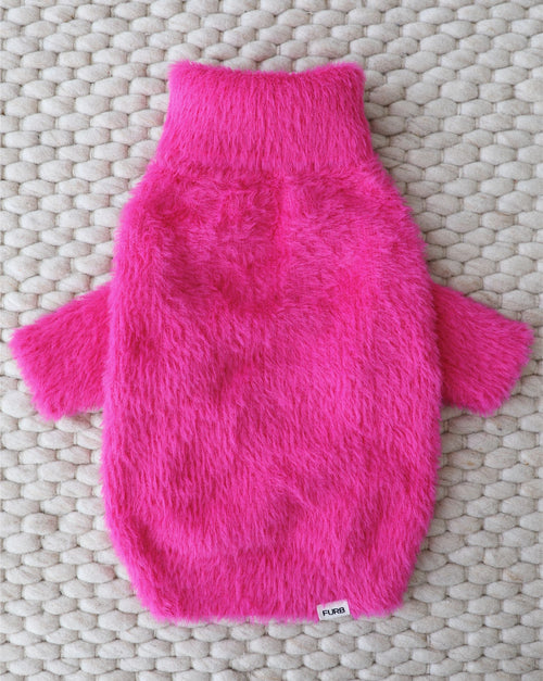 Cozy close-up of soft eyelash knit fabric in vibrant hot pink for small dogs.