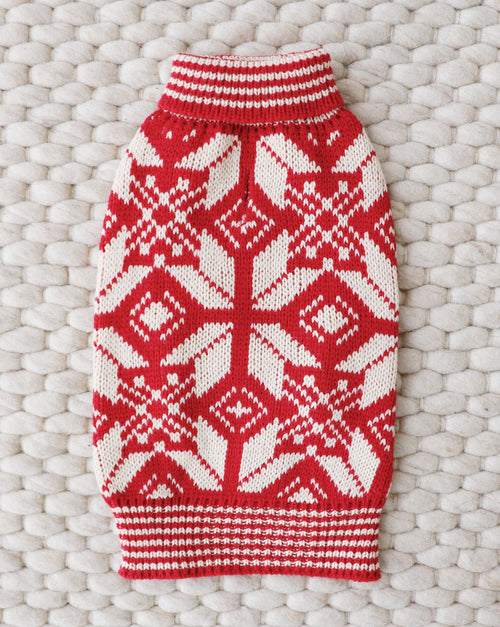 Red and white Santa-themed knit dog sweater for holiday cheer.