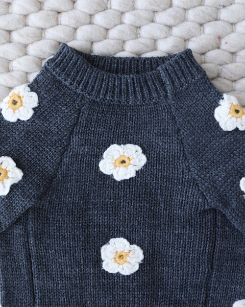 Angled shot of grey dog sweater with daisy details, perfect for layering and cooler-weather walks