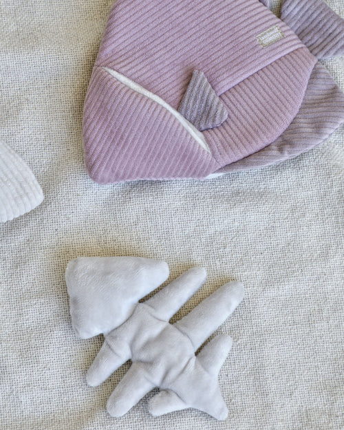 purple and pink corduroy fish dog toy with removable plush fish skeleton