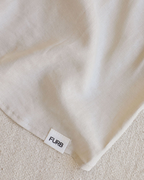 Oatmeal linen dog blouse close-up, showcasing the soft material and fit for small dogs like chihuahua.