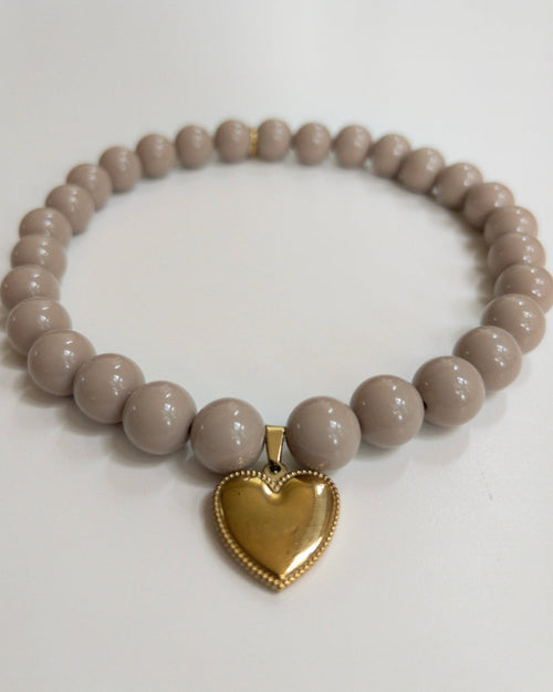 Close-up of Polished Pup taupe beaded dog necklace, stylish small dog accessory with elegant neutral beads for daily wear and photoshoots