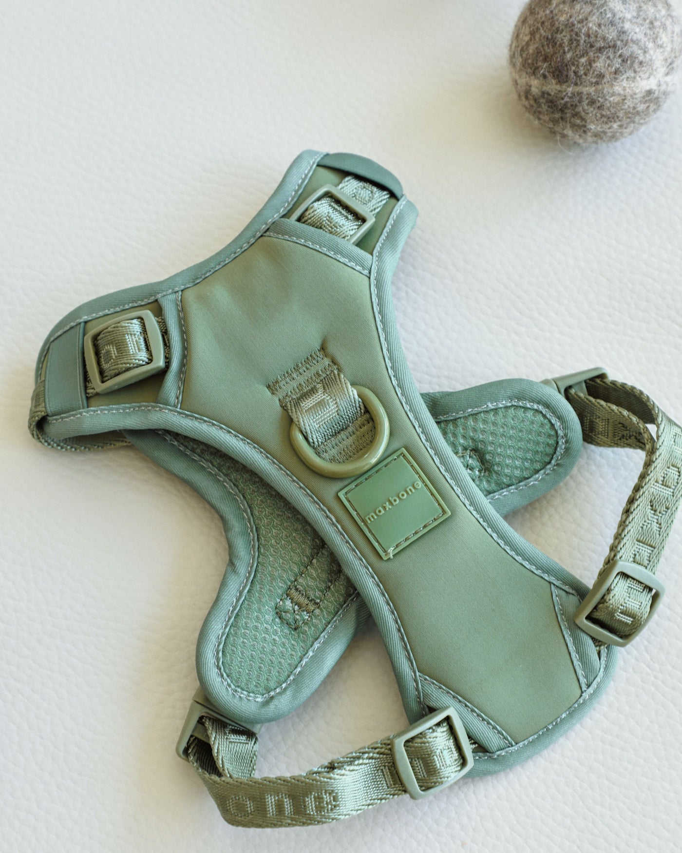 flat shot of sage green super soft nylon harness by maxbone