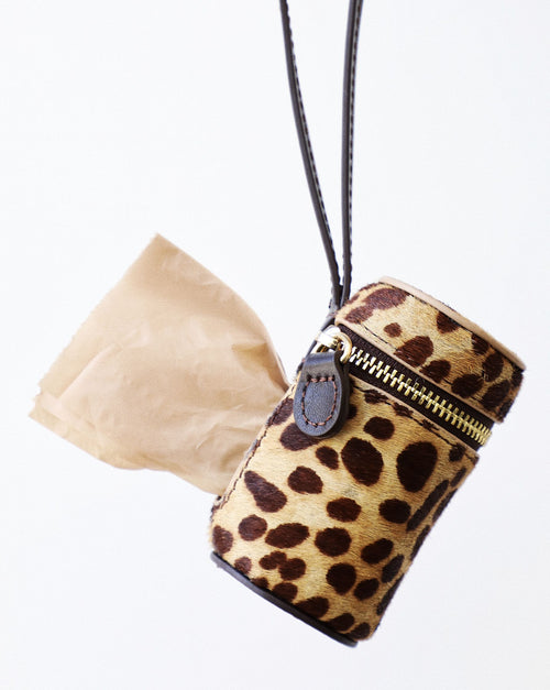 Brown spotted leash and waste bag holder set, a must-have for walks with small and medium dog breeds like Beagles and Pugs.