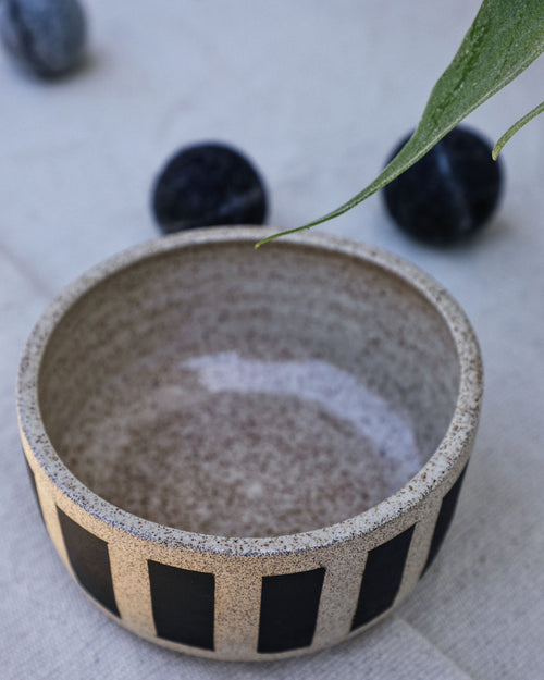 Each bowl is handmade with ceramic stonewear and striped, complete with a glaze to guarantee your pet eats and drinks safely. These bowls may vary in color and patinas, aging gracefully alongside your furry BFF.