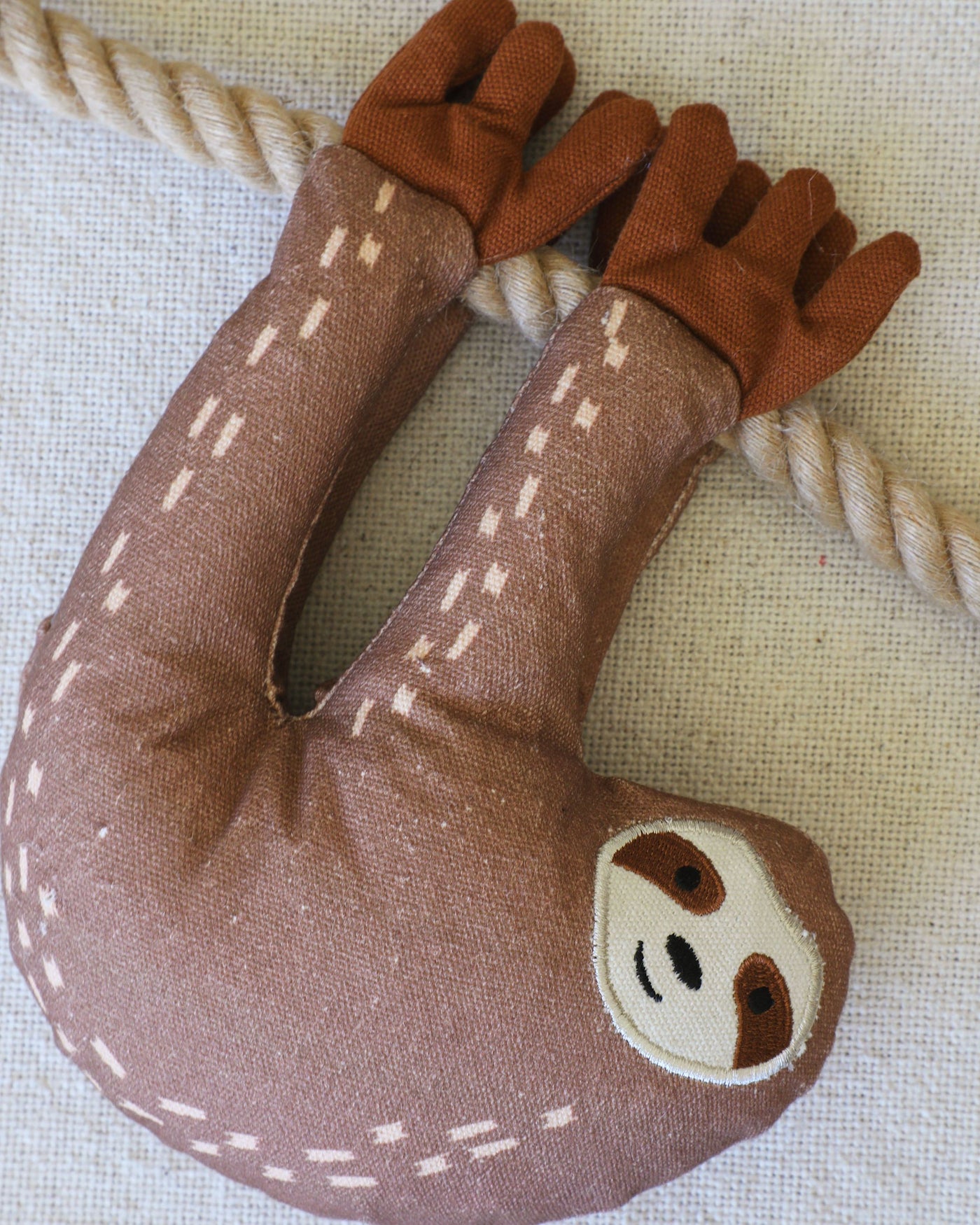 Eat Sleep Repeat Sloth Dog Toy Close Up