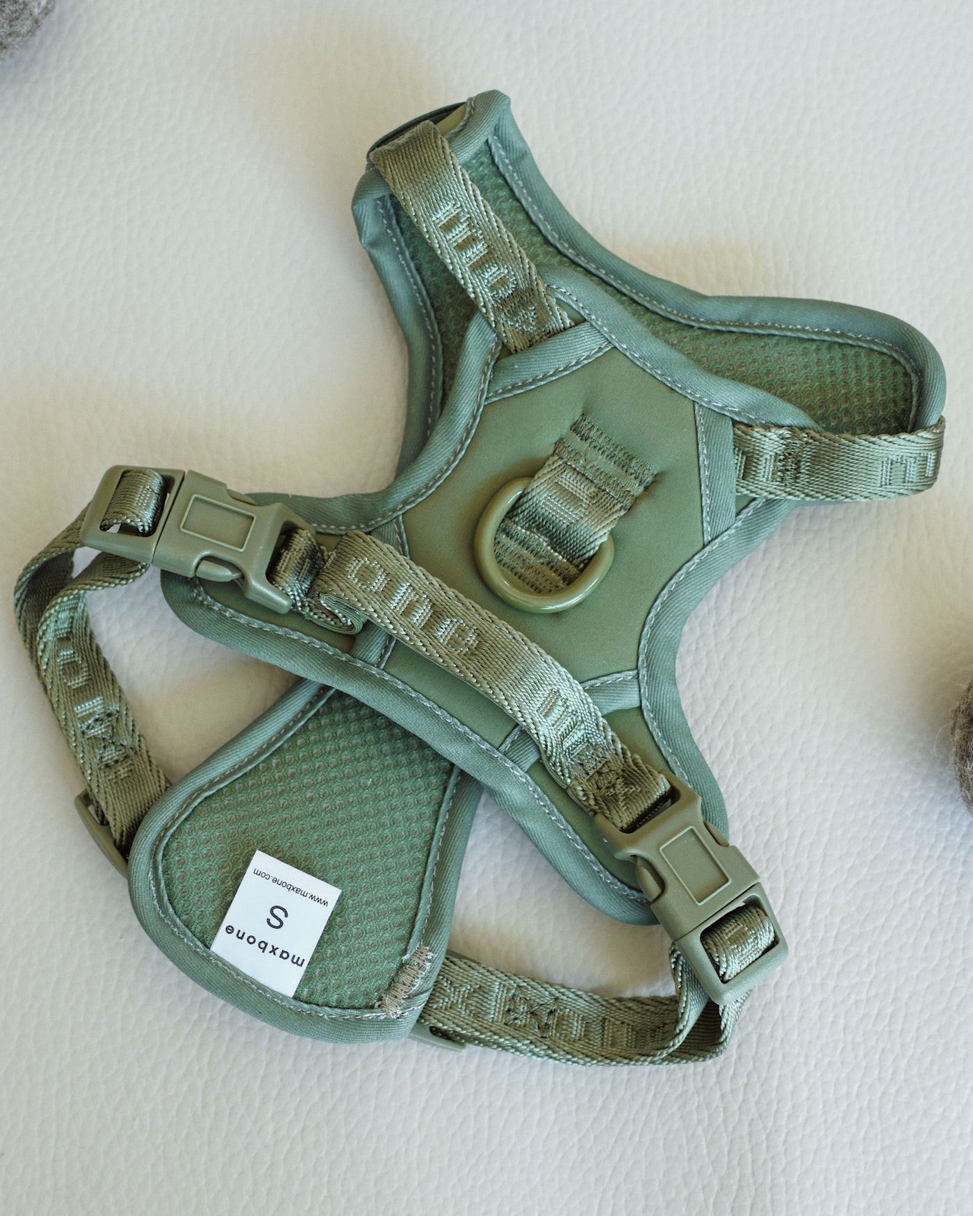 flat shot of sage green super soft nylon harness by maxbone