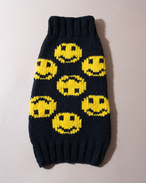 Smiley face black dog sweater, designed for fun-loving pets.