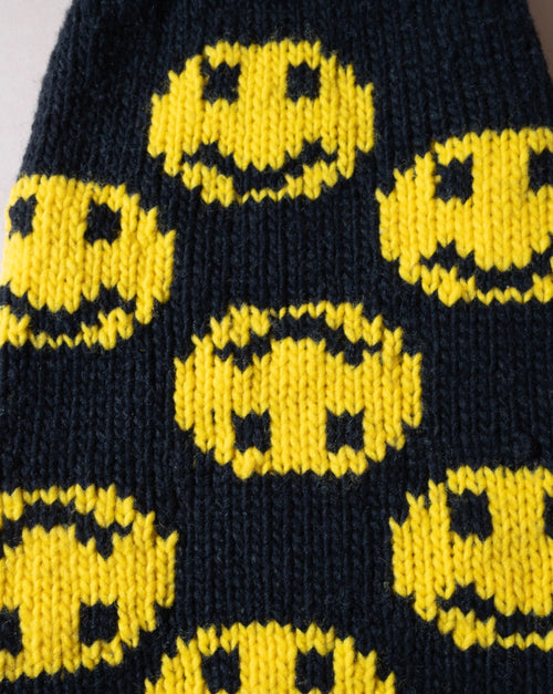 Adorable smiley face black dog sweater, perfect for pups who love to spread happiness.
