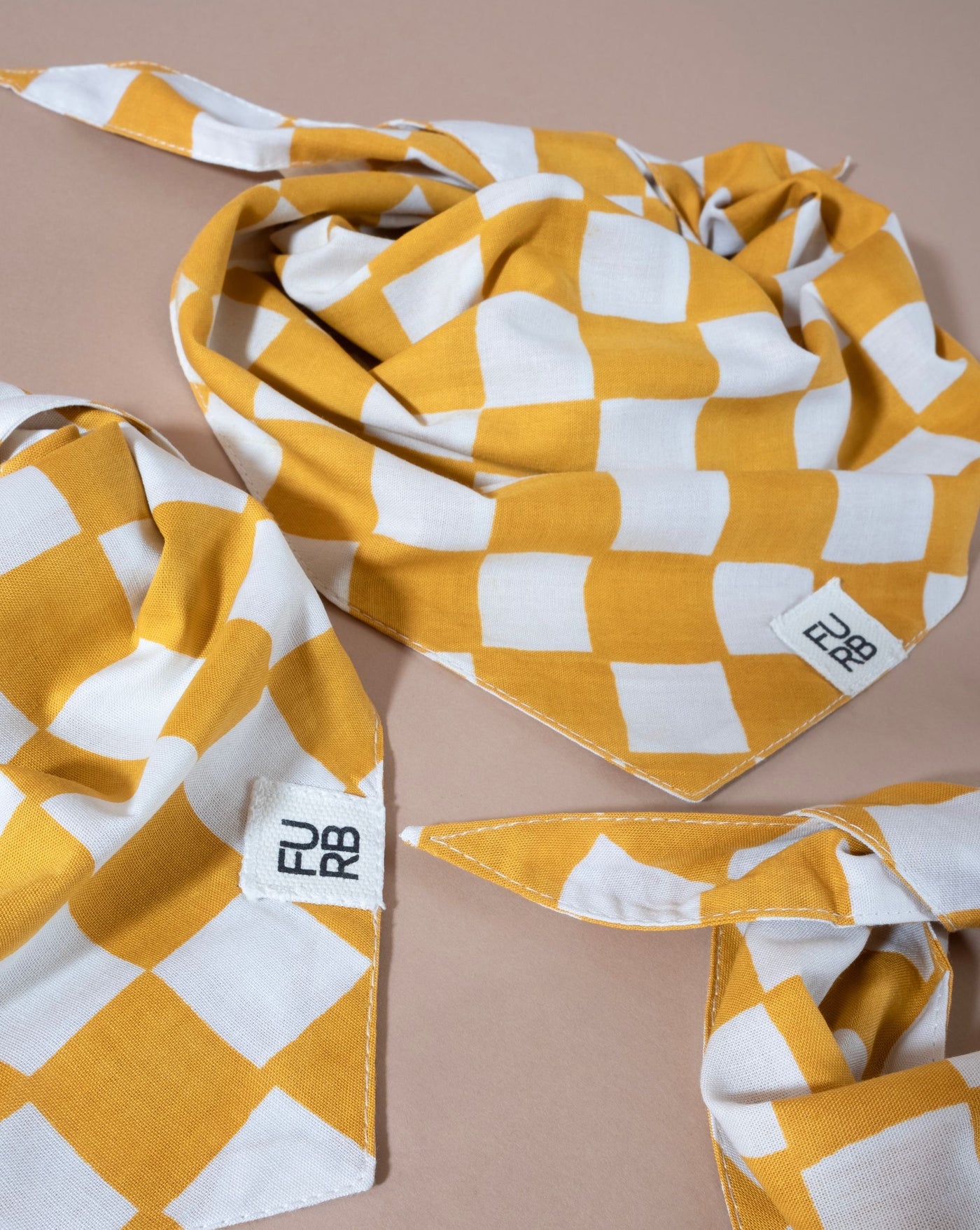 Stylish yellow checkered bandana for dogs, perfect for casual outings.