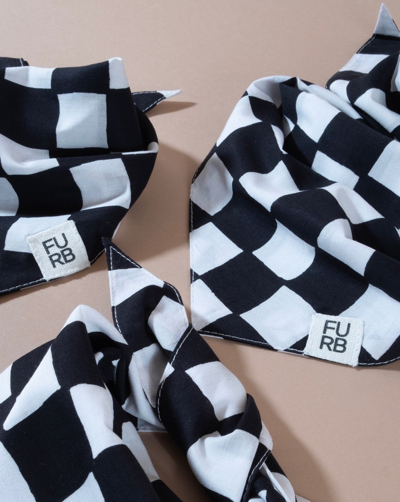 Checkered dog bandana in black, a great addition to your pup's outfit.