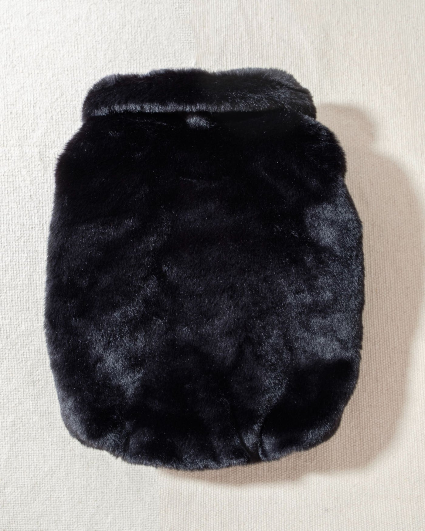 silky soft black faux fur and buttery ribbed leather accents. Matte, soft-feel snap buttons line the leather placket, leading to an oversized fur collar that wraps your fur babe in a warm hug. 