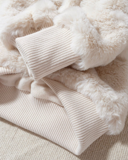 the total package: insanely touchable, wildly soft, hooded, and totally reversible. Thoughtful details and a chic design make this an instant classic, and when you realize the reverse side is just as cute, you&