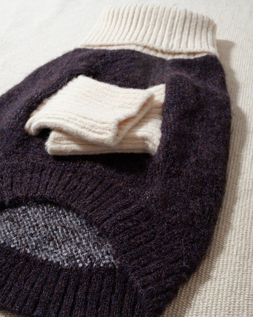 Felix Black + Ivory Dog Sweater, a chic design with coordinating sleeves and cozy turtleneck.