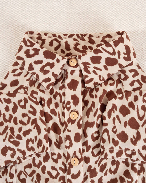 Leopard print button-up shirt for small and medium dog breeds, adding a fun and trendy twist to their wardrobe