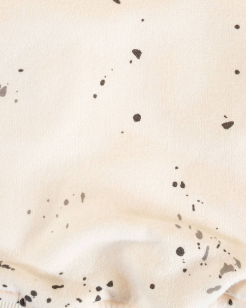 Stylish ivory hoodie for dogs, with a cool paint splatter design, perfect for small and medium-sized breeds.