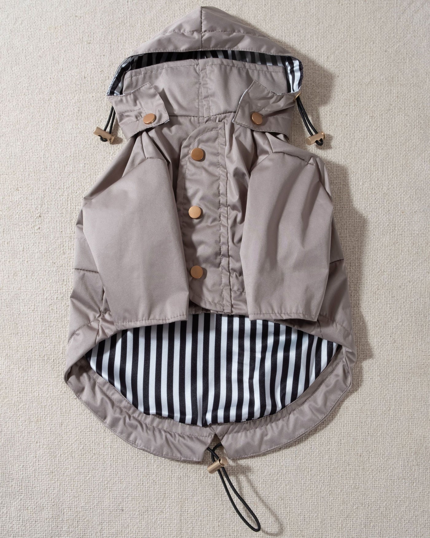 taupe dog raincoat with striped lining and removable hood