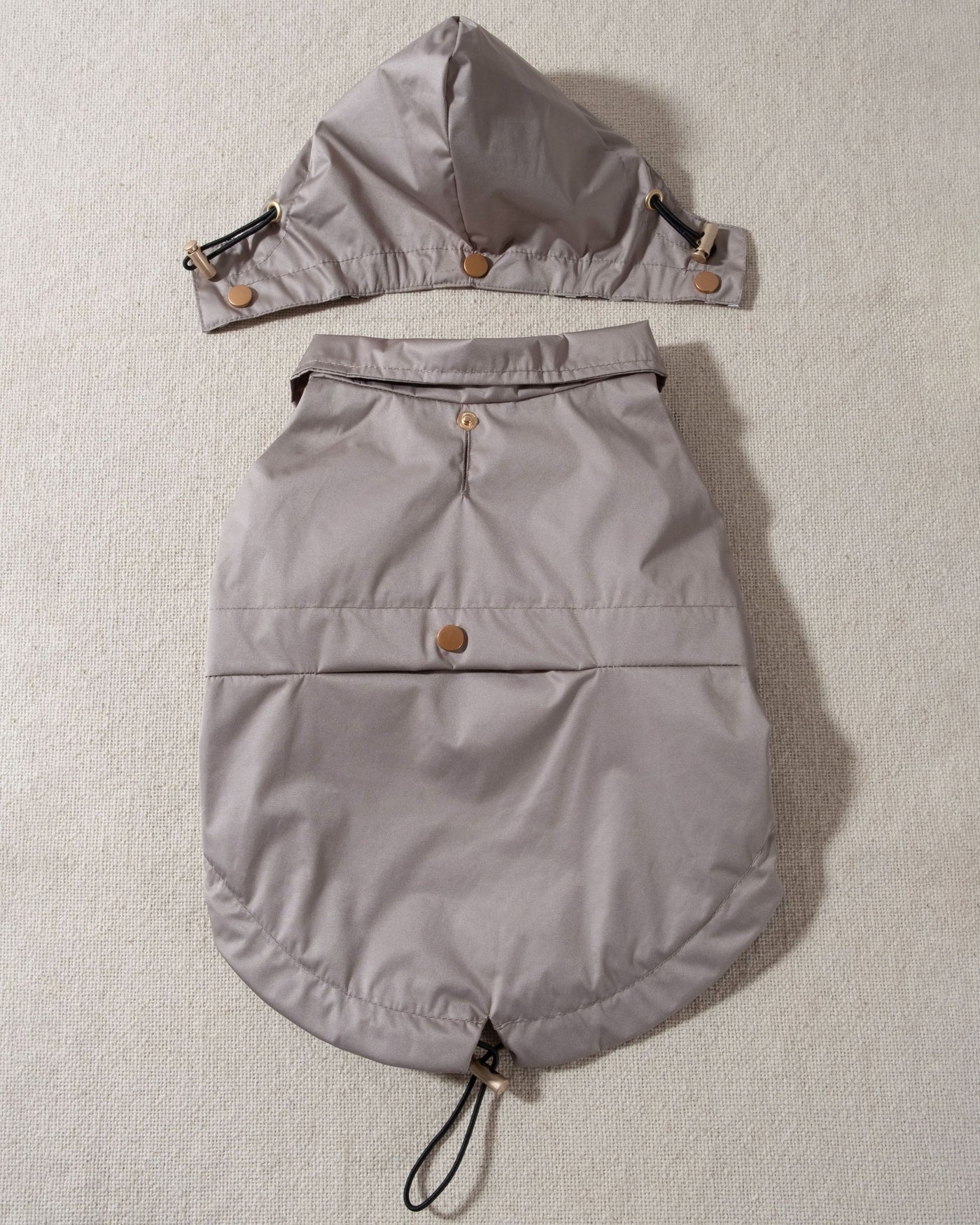 taupe dog raincoat with striped lining and removable hood