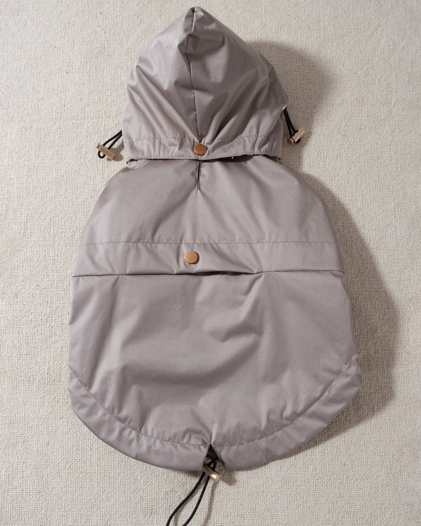 taupe dog raincoat with striped lining and removable hood